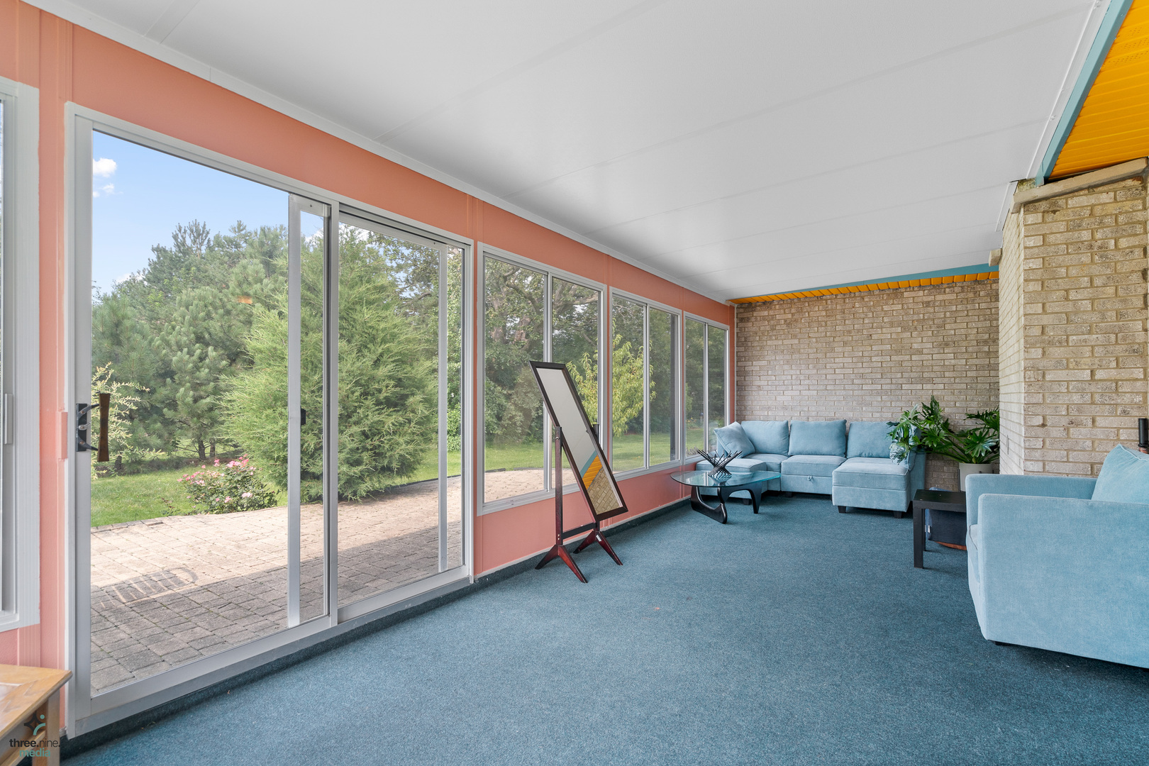 1224 Arbor Drive Lemont, IL 60439 - Photo 25 of 27 a living room with furniture and a floor to ceiling window
