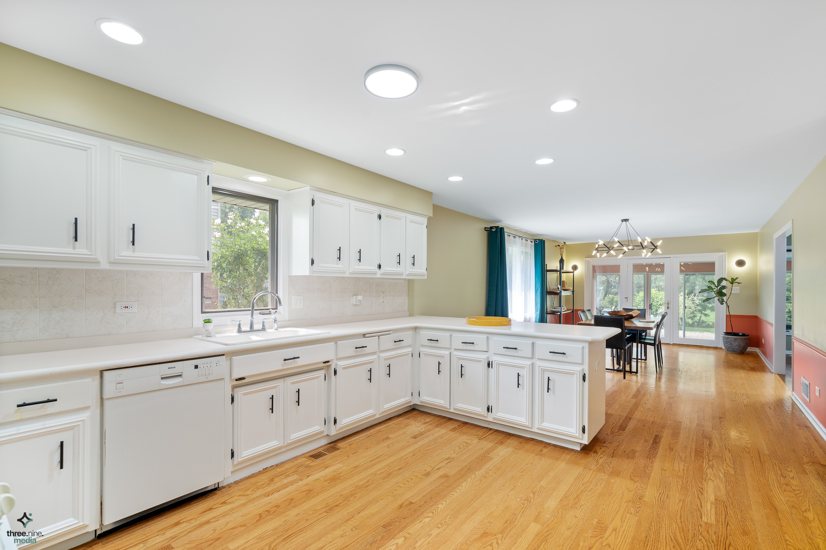 1224 Arbor Drive Lemont, IL 60439 - Photo 6 of 27 a large white kitchen with a large window