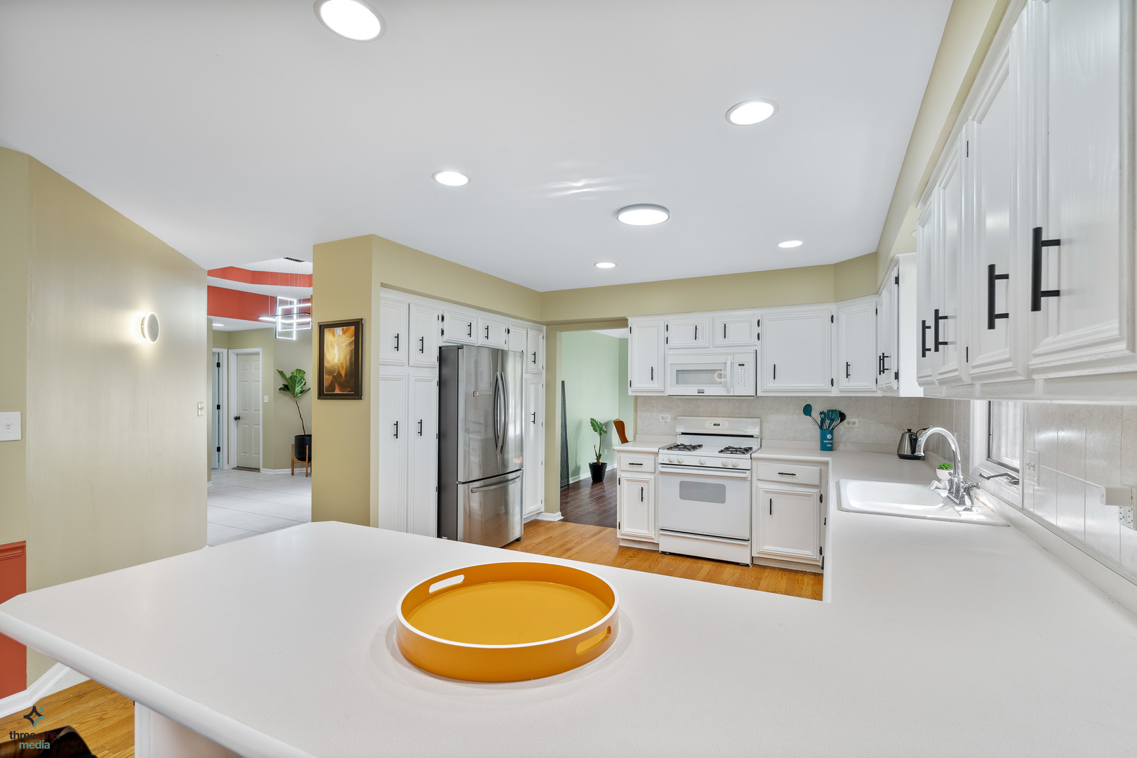 1224 Arbor Drive Lemont, IL 60439 - Photo 8 of 27 a kitchen with stainless steel appliances a stove a sink cabinets and a refrigerator