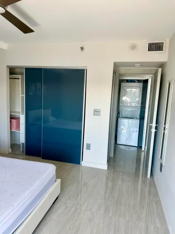 a bedroom with a bed and a mirror