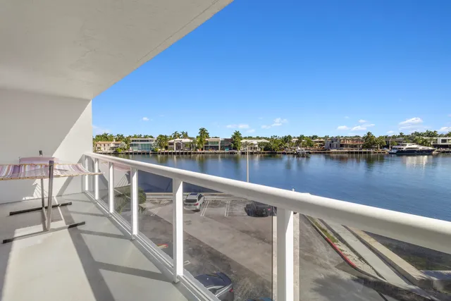 a view of a balcony with lake view and mountain view
