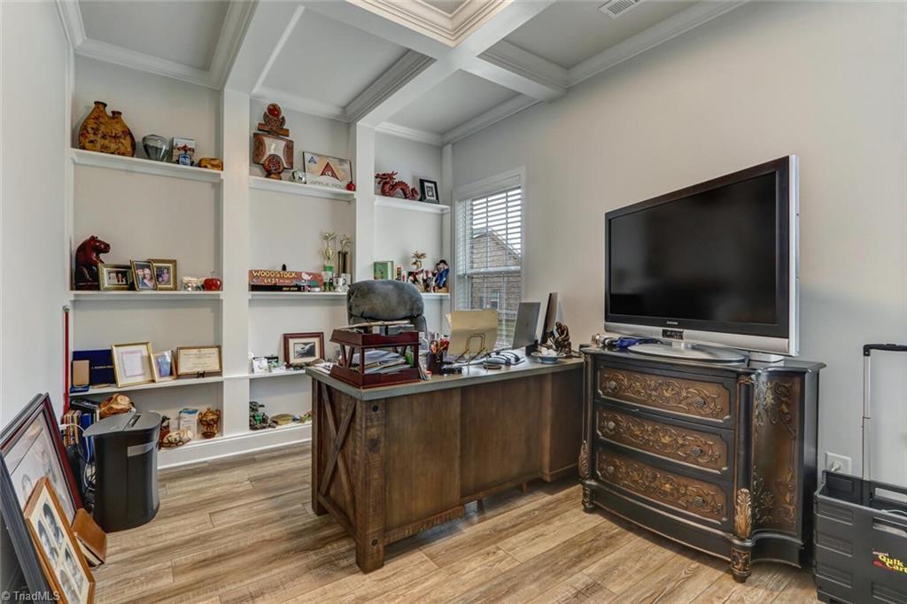6526 Marion Gibson Way Oak Ridge, NC 27310 - Photo 12 of 27 MAIN LEVEL OFFICE WITH BUILT IN SHELVING