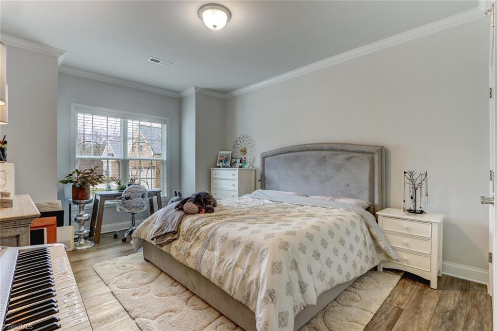 6526 Marion Gibson Way Oak Ridge, NC 27310 - Photo 19 of 27 FRONT BEDROOM MAIN LEVEL