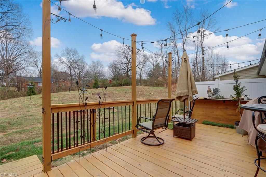 6526 Marion Gibson Way Oak Ridge, NC 27310 - Photo 24 of 27 REAR DECK OFF SUNROOM