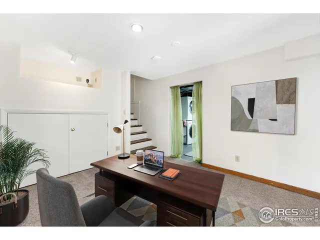 a view of a workspace with furniture