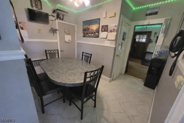 a bedroom with two beds and a flat screen tv