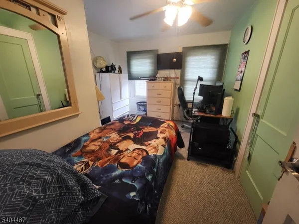 a living room with lots of furniture and a window