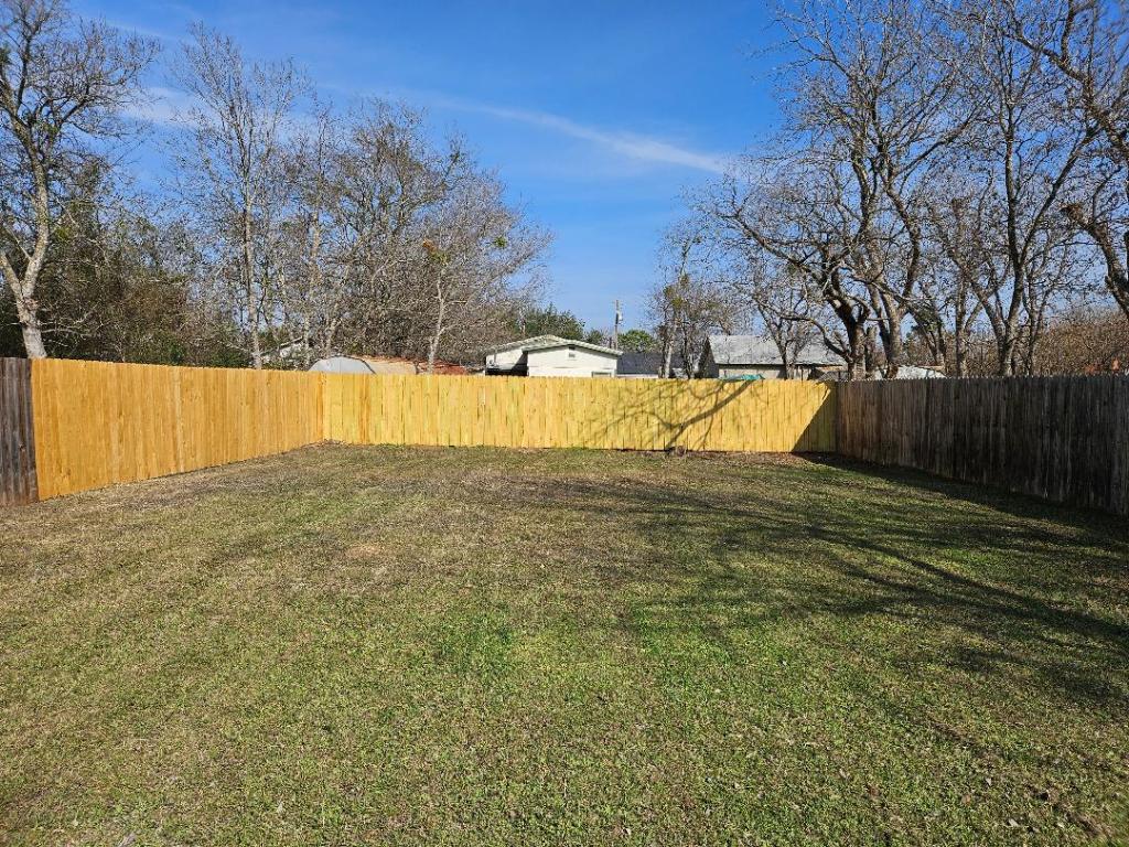 105 Ila Street, Unit B Elgin, TX 78621 - Photo 12 of 12 View of fenced backyard