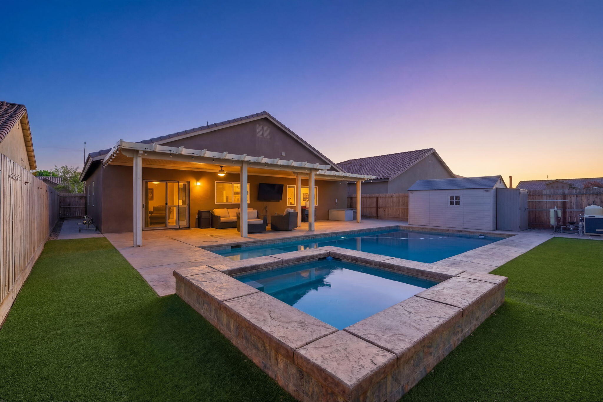 756 Strada Street Lemoore, CA 93245 - Photo 38 of 53 a view of house with backyard swimming pool and outdoor seating