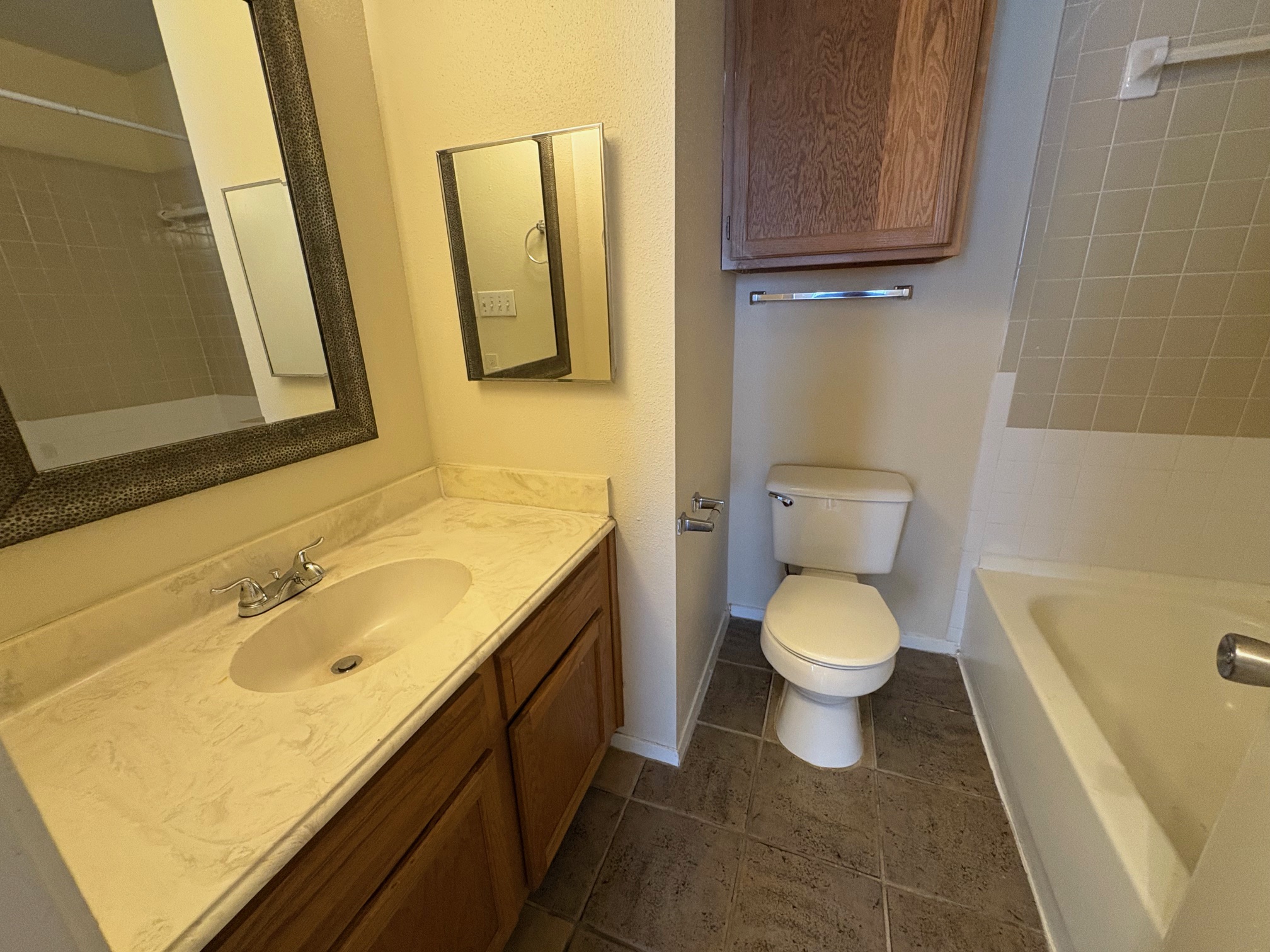 2801 Rio Grande Street, Unit 303 Austin, TX 78705 - Photo 11 of 11 Full bathroom with vanity, shower combination, and dark tile patterned floors