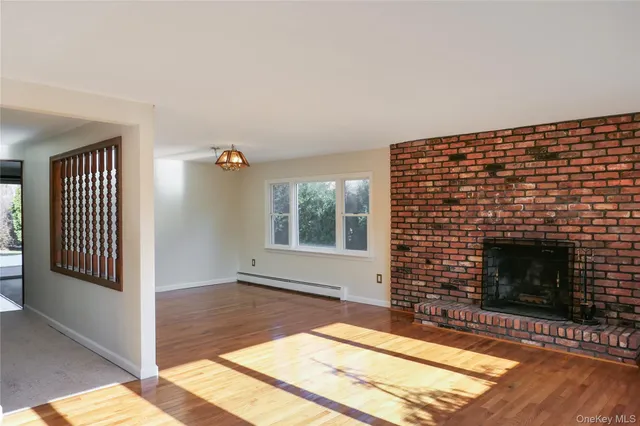 a view of kitchen with stainless steel appliances granite countertop a refrigerator and cabinets