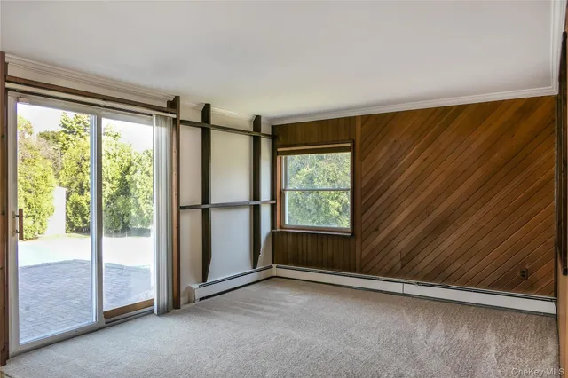 a kitchen with a refrigerator a sink and cabinets