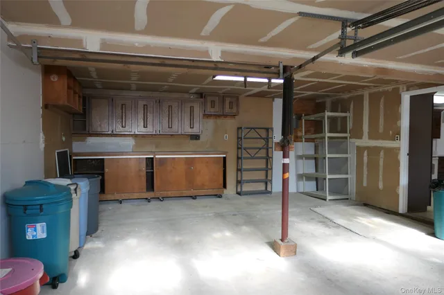 a view of an empty room with wooden walls