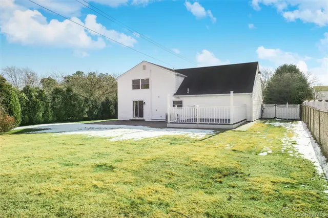 a view of a backyard of the house