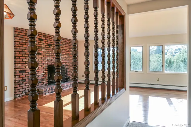 a view of room with window and wooden floor
