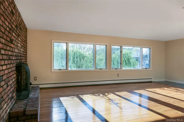 a view of fireplace and wooden floor