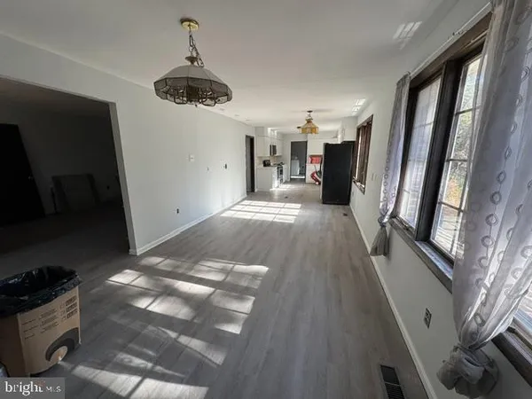 a view of a hallway with windows