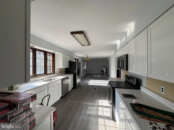 a balcony with wooden floor and lake view