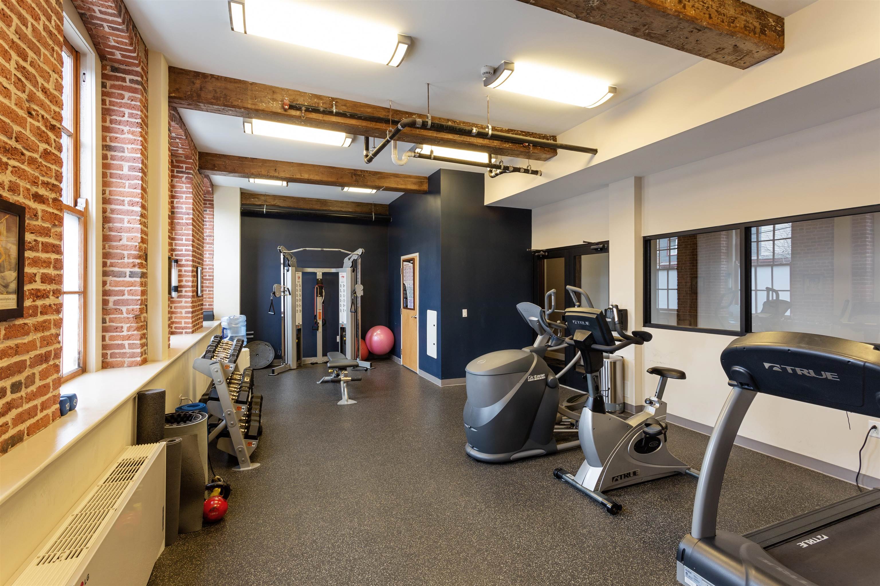 154 Ave East, Unit C304 Bayonne, NJ 07002 - Photo 13 of 19 a view of a room with gym equipment