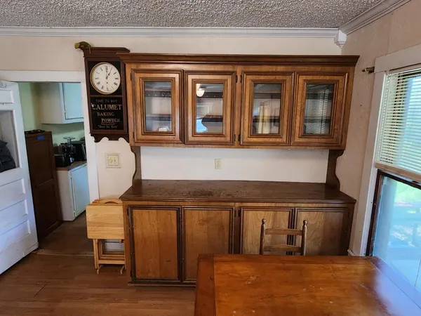 a view of a chairs and a refrigerator in a kitchen