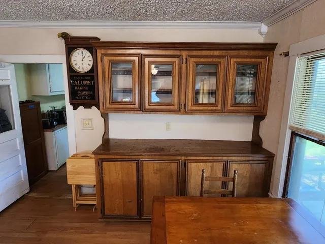a view of a chairs and a refrigerator in a kitchen