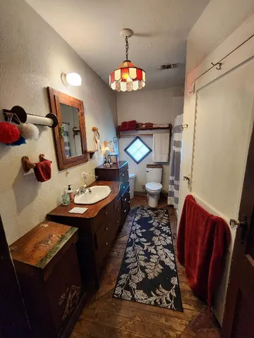 a dining room with furniture and a chandelier