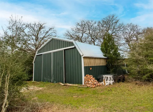 a view of a house with a yard and garage