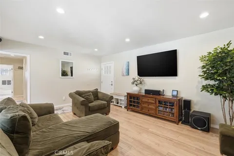 a living room with furniture and a rug