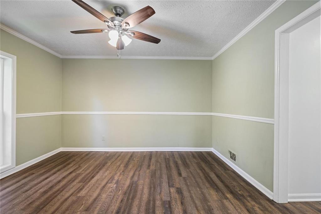 4505 Cochran Mill Road Fairburn, GA 30213 - Photo 7 of 36 wooden floor in an empty room with a window