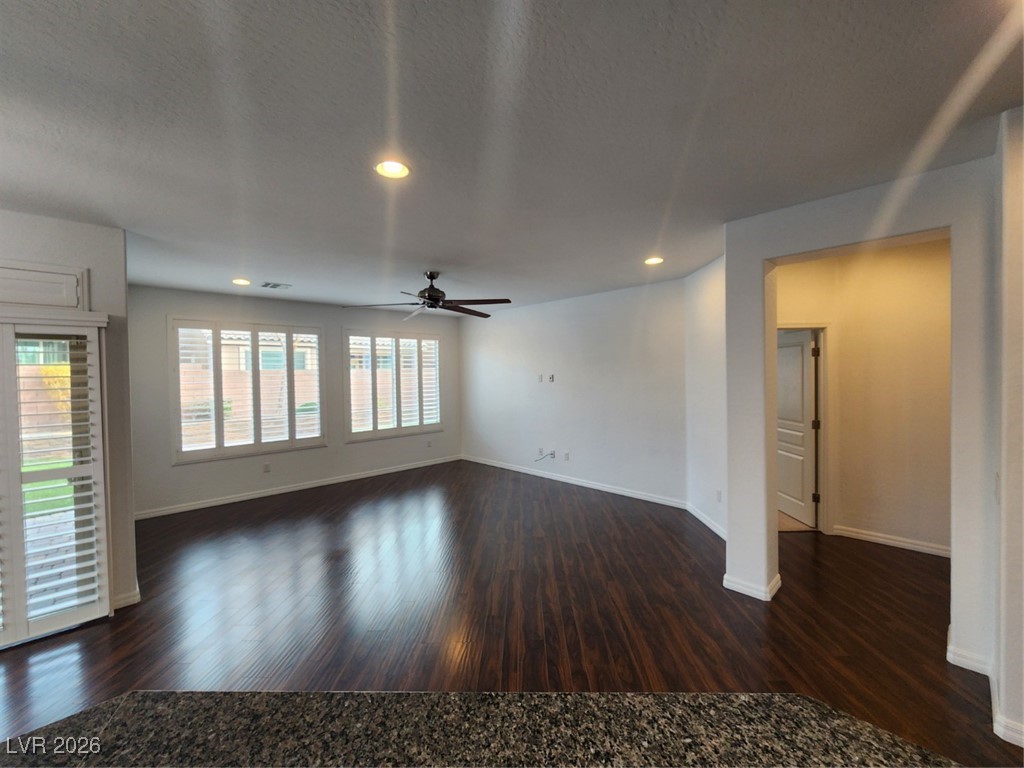 7022 Cordite Road Las Vegas, NV 89178 - Photo 9 of 51 Spare room with recessed lighting, dark wood-style floors, ceiling fan, and a textured ceiling