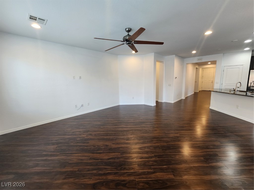7022 Cordite Road Las Vegas, NV 89178 - Photo 11 of 51 Unfurnished living room with recessed lighting, dark wood-style flooring, and ceiling fan