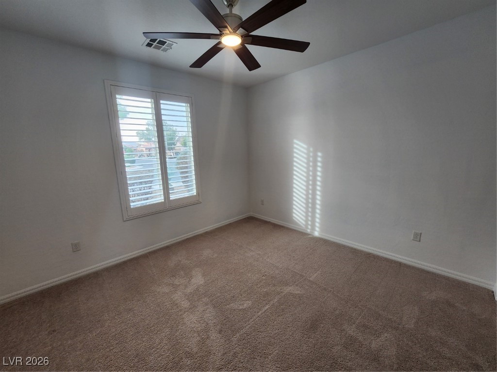 7022 Cordite Road Las Vegas, NV 89178 - Photo 16 of 51 Unfurnished room with carpet floors and a ceiling fan