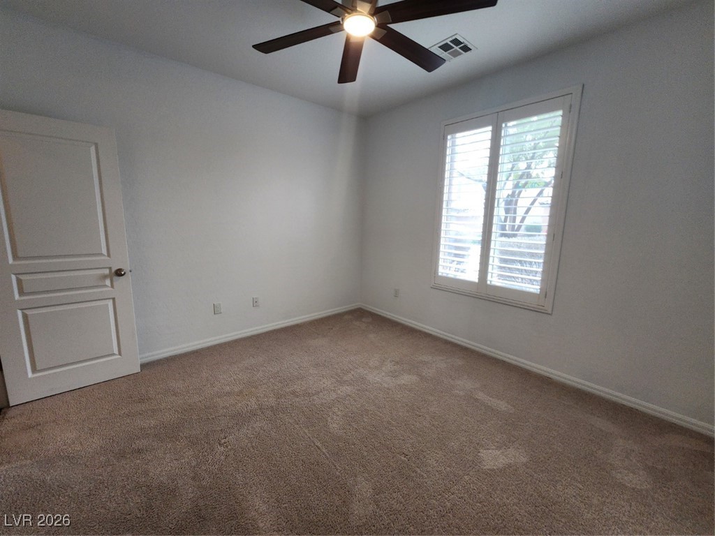 7022 Cordite Road Las Vegas, NV 89178 - Photo 19 of 51 Spare room featuring carpet and ceiling fan