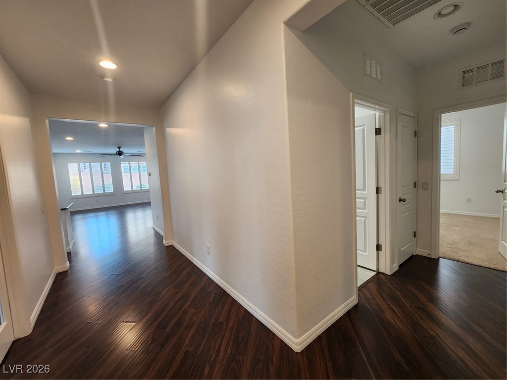 7022 Cordite Road Las Vegas, NV 89178 - Photo 20 of 51 Corridor with dark wood-style floors and recessed lighting
