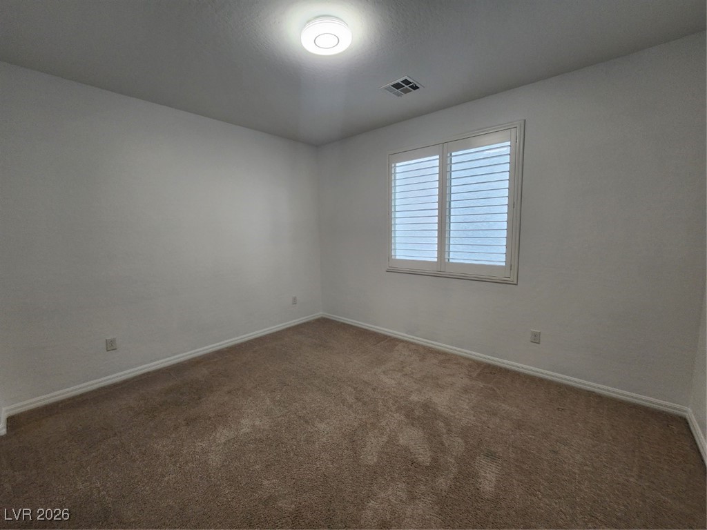 7022 Cordite Road Las Vegas, NV 89178 - Photo 22 of 51 Carpeted empty room with baseboards