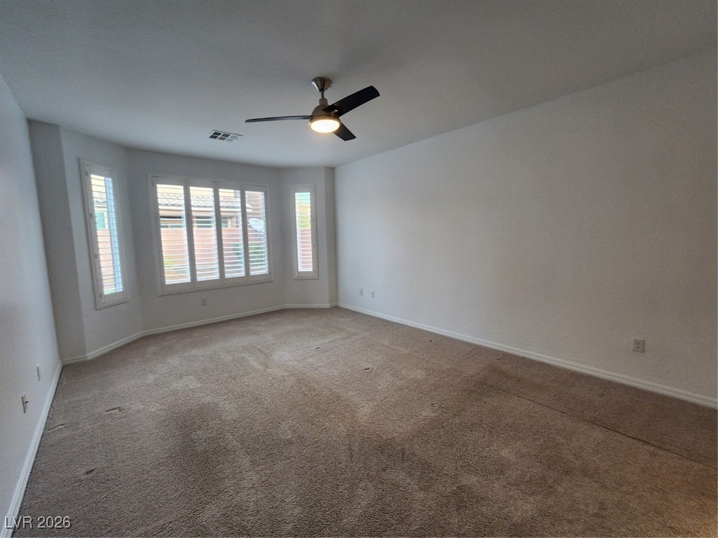 7022 Cordite Road Las Vegas, NV 89178 - Photo 28 of 51 Unfurnished room with carpet floors and a ceiling fan