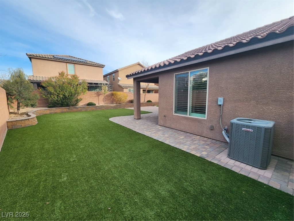 7022 Cordite Road Las Vegas, NV 89178 - Photo 41 of 51 Fenced backyard with a patio