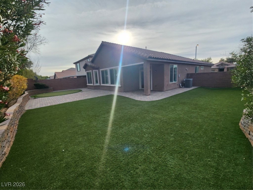 7022 Cordite Road Las Vegas, NV 89178 - Photo 42 of 51 Back of property featuring stucco siding, a patio, a fenced backyard, and a tiled roof