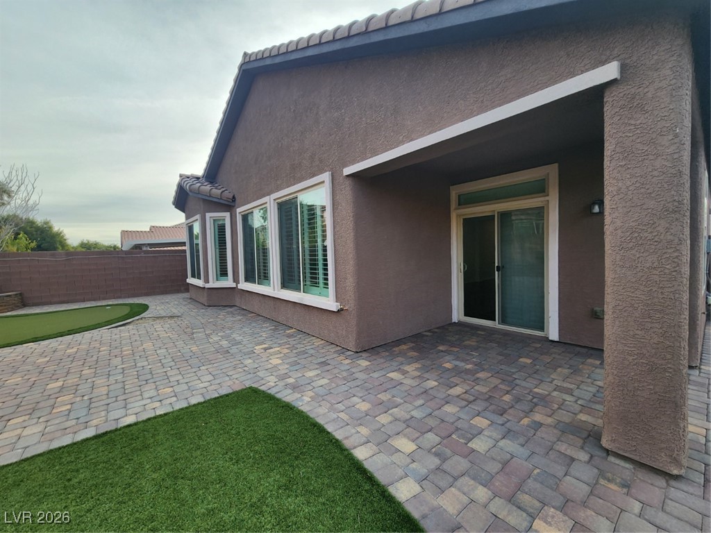 7022 Cordite Road Las Vegas, NV 89178 - Photo 45 of 51 View of patio / terrace featuring a putting area