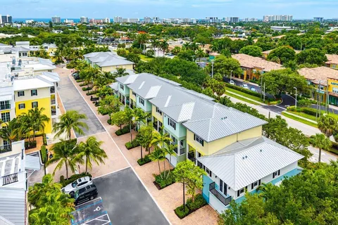 an aerial view of residential houses with outdoor space