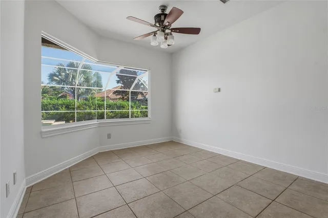 a view of a backyard with swimming pool