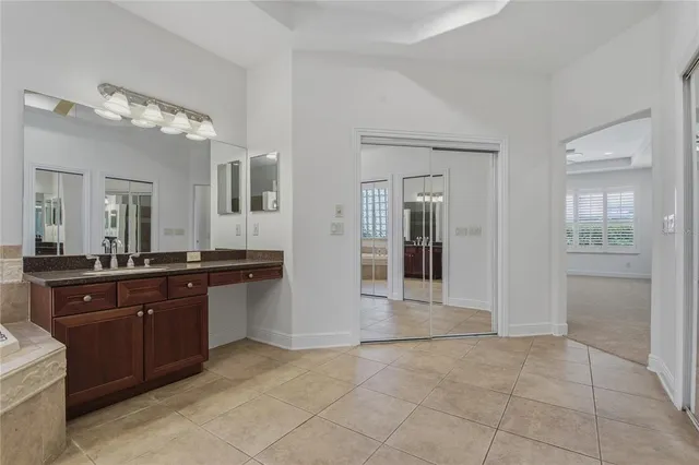an aerial view of a tennis ground with a garden