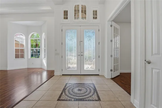 a living room with furniture tv and a window