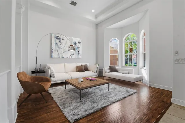 a large kitchen with a large counter top and stainless steel appliances