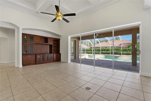 a large kitchen with a stove a refrigerator and a sink