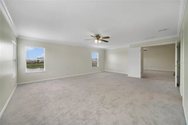 a view of an empty room with a window