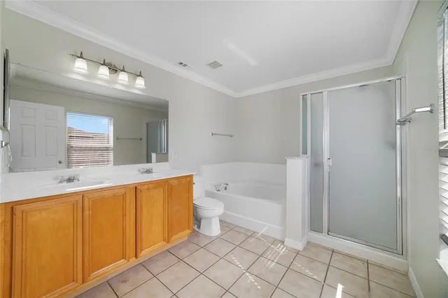 a bathroom with a bathtub shower sink mirror and toilet