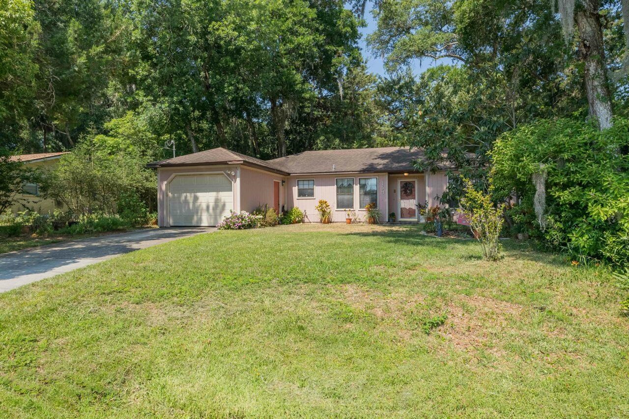 154 Drake Road St. Augustine, FL 32086 - Photo 2 of 36 a front view of a house with a yard and trees