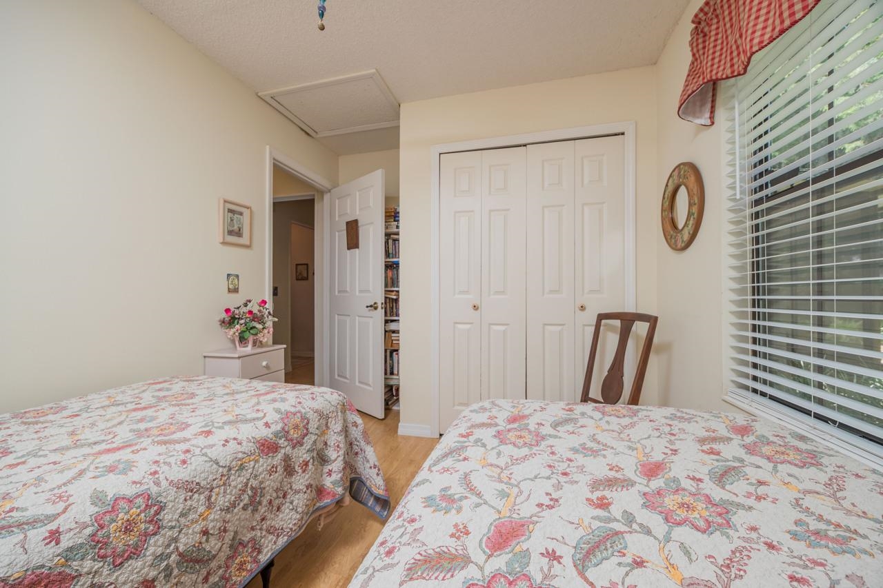 154 Drake Road St. Augustine, FL 32086 - Photo 28 of 36 a bedroom with a bed and a mirror