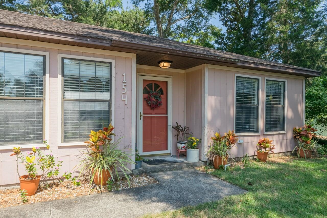 154 Drake Road St. Augustine, FL 32086 - Photo 5 of 36 a front view of a house with a yard